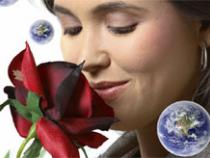 Girl smelling a rose with planet in the corner