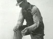 Farmer holding dry soil