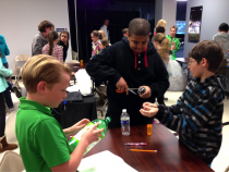 Students building rain gauges