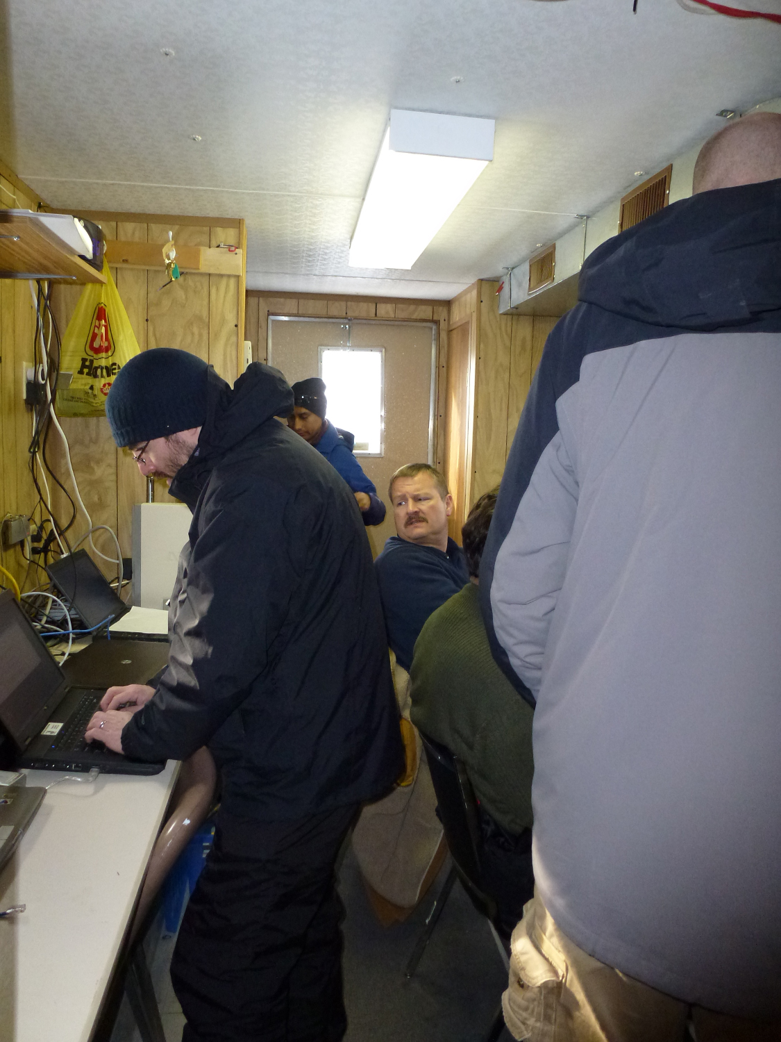 GCPEx scientists inside the cramped operations trailer