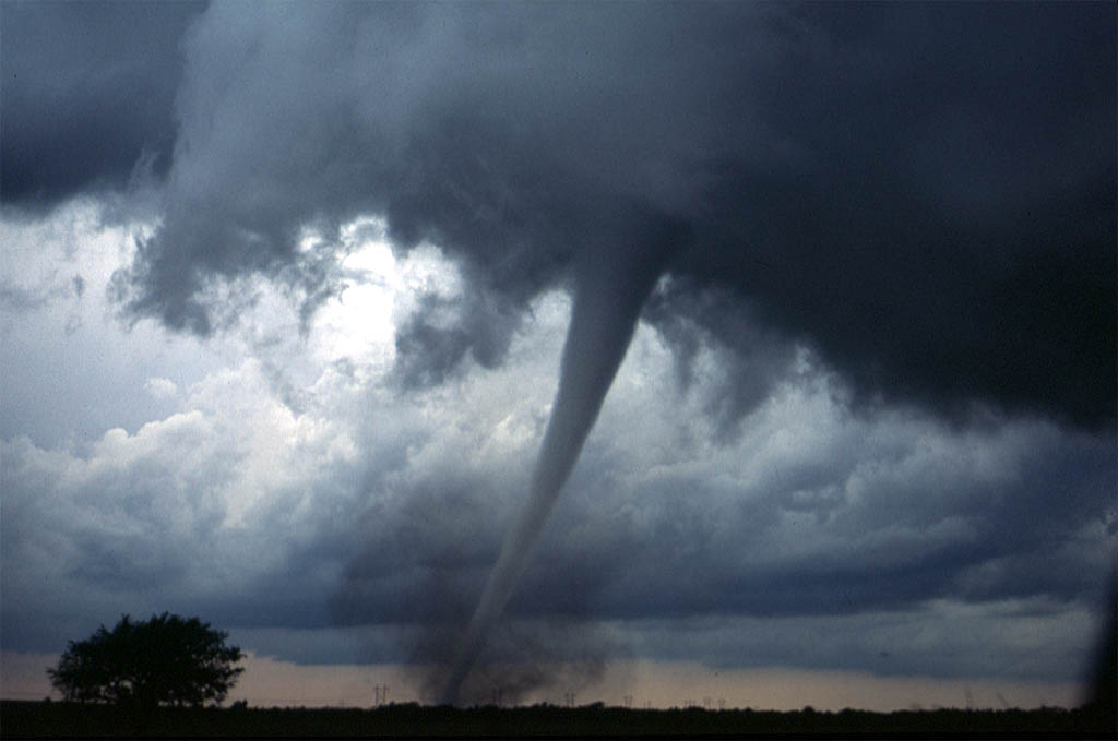 Tornado funnel in a field