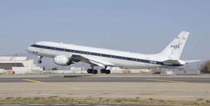 The DC-8 aircraft taking off from a runway