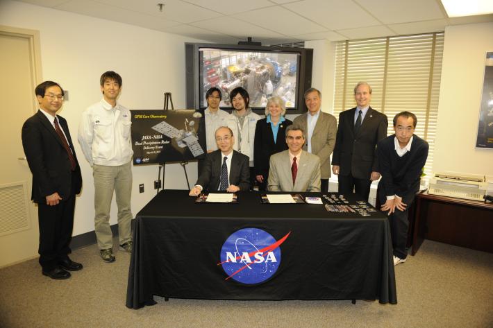 NASA and JAXA officials at the DPR sign-off event