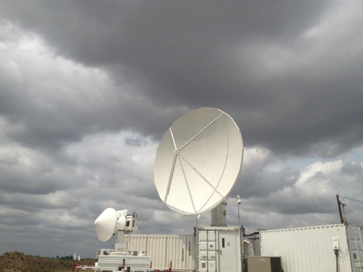 The NASA Polarimetric Radar (right) and Dual-Frequency, Dual-Polarimetric Doppler Radar (left) set up in field near Traer, Iowa.