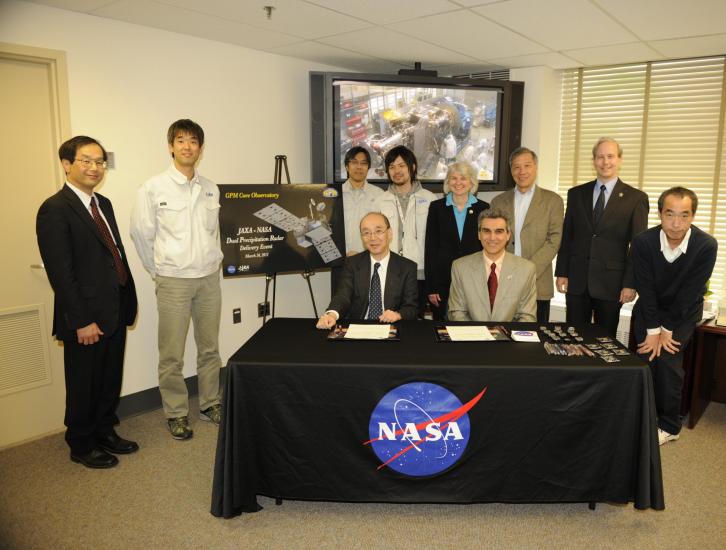 NASA and JAXA officials at the DPR signing event