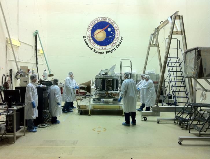 Scientists stand around the GMI which just arrived at NASA Goddard