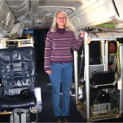 Scientist Gail Skofronick-Jackson standing in the DC-8 aircraft